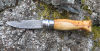 Opinel, burr yew Odins eye Damascus